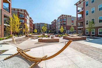 A Swing Set in The Middle of a Courtyard at The Aster Apartments, Cary, NC, 27519